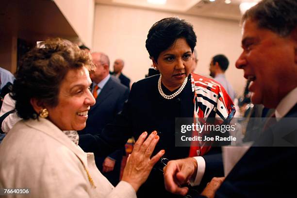 PepsiCo's chair and CEO, Indra Nooyi talks with Donna E. Shalala, president of the University of Miami, and Alberto Ibarguen, president and CEO of...