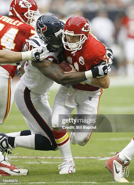 Defensive end Mario Williams of the Houston Texans tackles Quarterback Damon Huard during the game between the Houston Texans and the Kansas City...