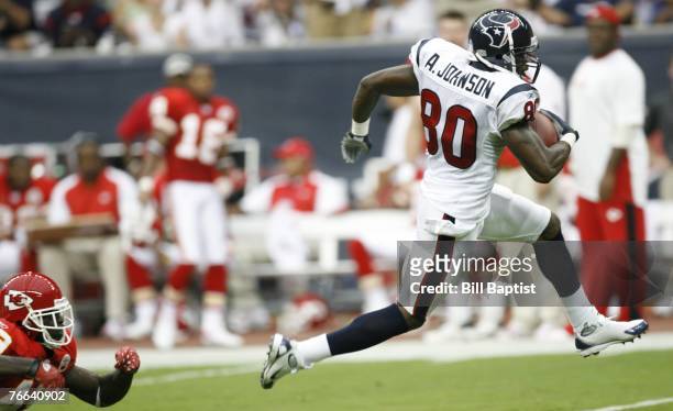 Wide receiver Andre Johnson of the Houston Texans runs past Jon McGraw of the Kansas City Chiefs during the game between the Houston Texans and the...