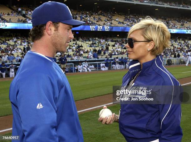 Victoria Beckham is greeted by Dodger catcher Mike Lieberthal prior to the Los Angeles Dodgers vs New York Mets game Monday, June 11, 2007 at Dodger...