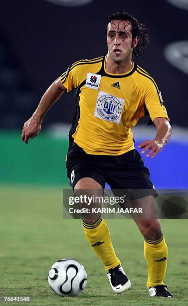 Qatar's Iranian footballer Ali Karimi controls the ball during their Qatari championship football match against al-Wakra in Doha 10 September 2007....