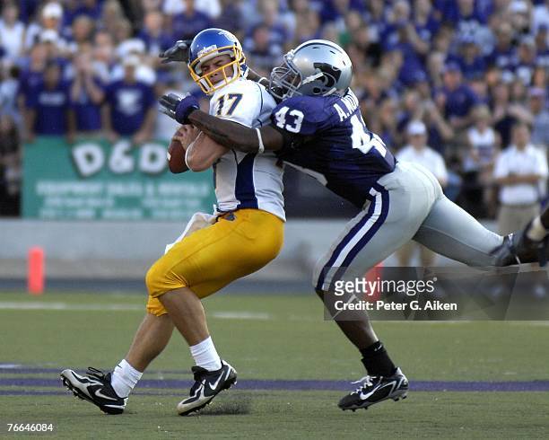 Linebacker Antwon Moore of the Kansas State Wildcats sacks quarterback Adam Tafralis of the San Jose State Spartans during a NCAA football game...