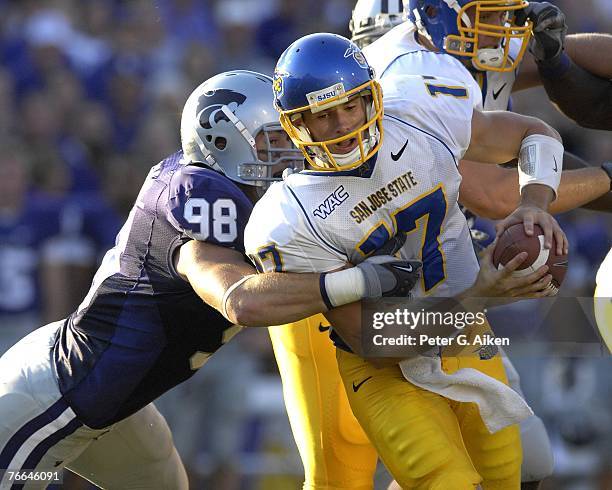 Linebacker Ian Campbell of the Kansas State Wildcats tackles quarterback Adam Tafralis of the San Jose State Spartans during a NCAA football game on...