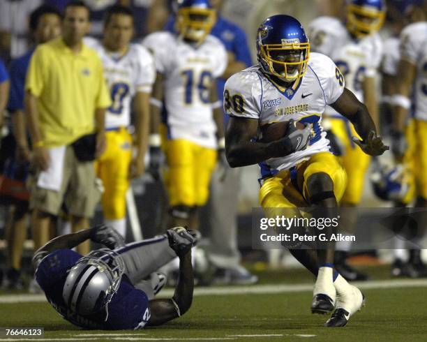 Wide receiver Terrance Williams of the San Jose State Spartans spins away from a tackle from defensive back Justin McKinney of the Kansas State...