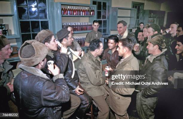 American and Canadian Airmen relax at the PX at a joint Royal Canadian Air Force and United States Army Air Force base in December 1942 in Goose Bay,...