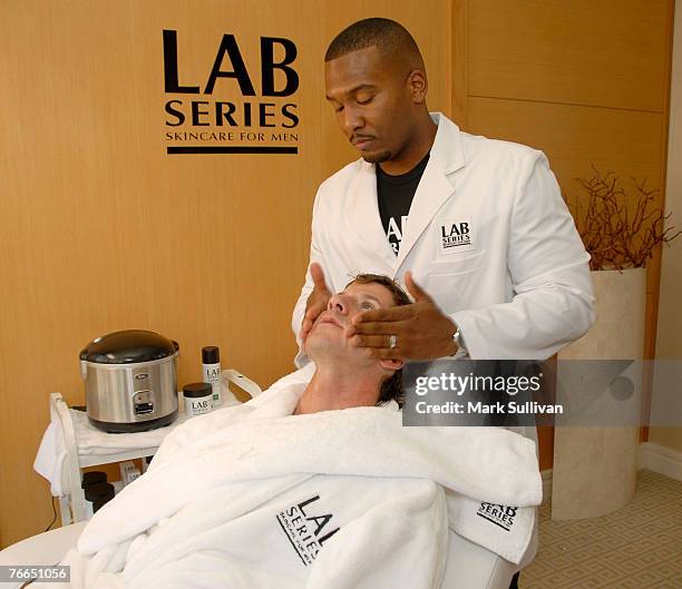 Model Trey Knight receives a shave from barber Craig Whitely at the Lab Series Emmy Suite in Los Angeles, California on September 10, 2007.