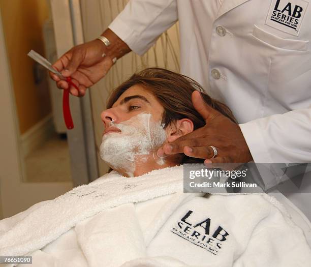 Model Omar Avila receives a shave from barber Craig Whitely at the Lab Series Emmy Suite in Los Angeles, California on September 10, 2007.