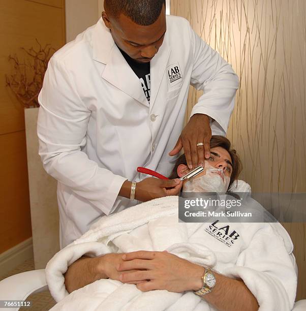 Model Omar Avila receives a shave from barber Craig Whitely at the Lab Series Emmy Suite in Los Angeles, California on September 10, 2007.