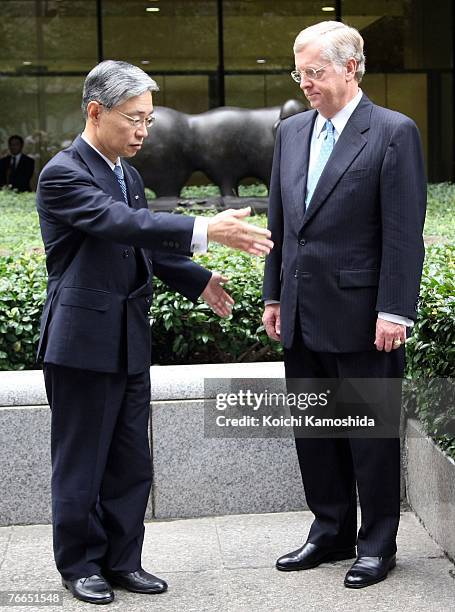 Ambassador to Japan Thomas Schieffer pays his respects with Mizuho Financial Group executive President Terunobu Maeda at the the 9/11 memorial in...