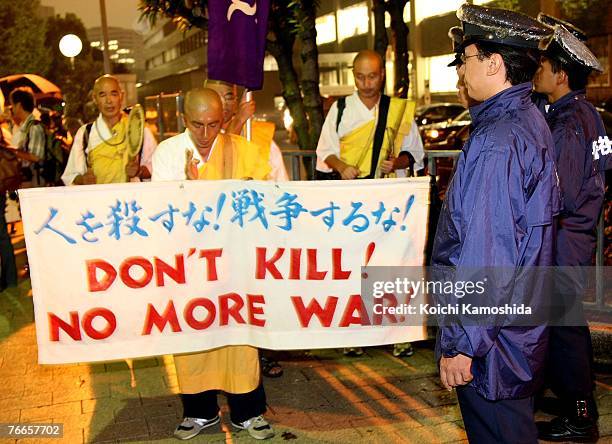 Japanese Buddhist monks and peace activists protest against the dispatch of Self-Defense Force vessels to the Indian Ocean under the special...