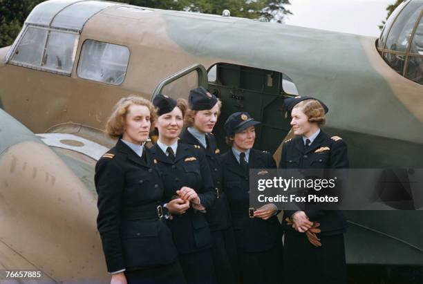 Women pilots of the Air Transport Auxiliary , standing next to an Airspeed Oxford trainer, 1942. Left to right: Lettice Curtis, Jenny Broad, Wendy...