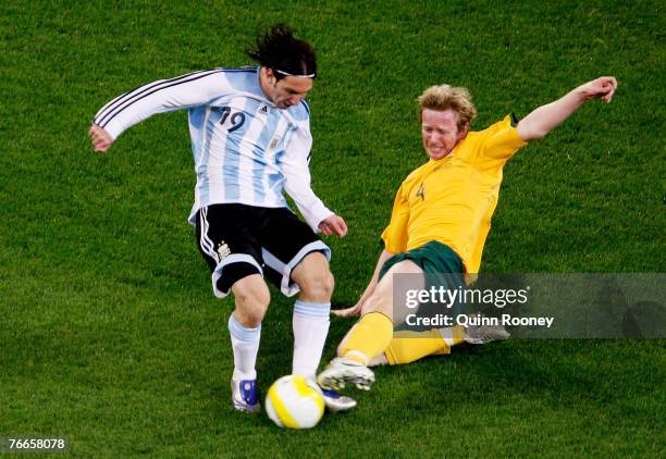 David Carney of the Socceroos and Lionel Messi of Argentina contest for the ball during the international friendly match between the Australian...