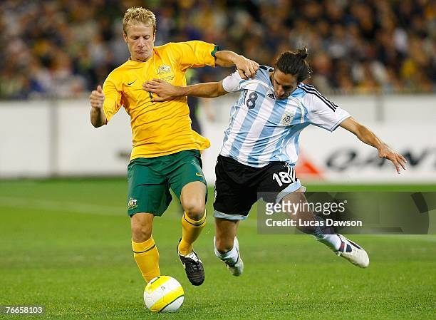Gabriel Heinze of Argentina and Vincenzo Grella of Australia in action during the international friendly match between the Australian Socceroos and...