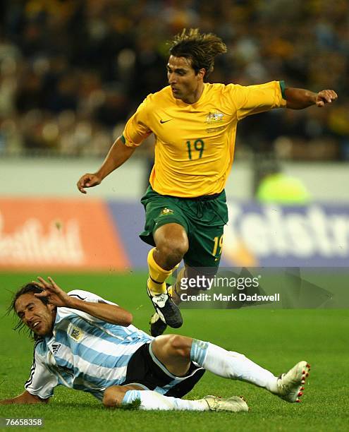 Nick Carle of the Socceroos leaps an opponent during the international friendly match between the Australian Socceroos and Argentina at the Melbourne...
