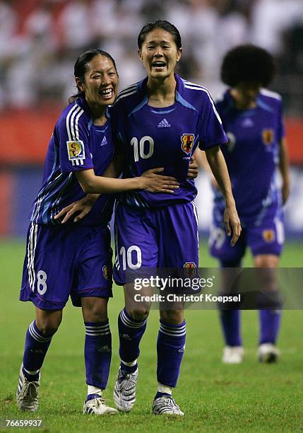 Tomoe Sakai of Japan and Homare Sawa celebrate their 2-2 draw during the FIFA Women's World Cup 2007 Group A match between Japan and England at the...