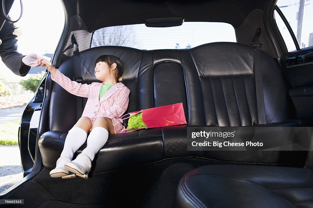 Girl sitting in limousine