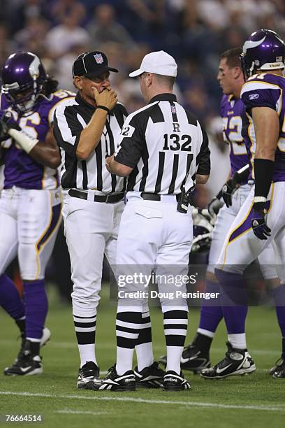 Referee John Parry and Side Judge Laird Hayes work the field as the Minnesota Vikings defeated the Atlanta Falcons 24-3 at the Metrodome on September...