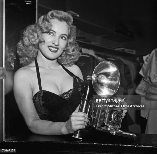 Rene Bartoly, the camera girl, is one of the features of the famous Mocambo nightclub on the Sunset Strip on July 1 in Hollywood, California.