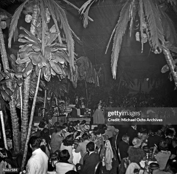 Singer warbles in front of a rapt audience at the Cocoanut Grove Nightclub at the Ambassador Hotel on July 3 in Hollywood, California.