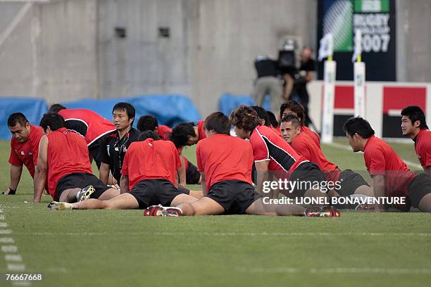 Japan's rugby union national team players strech during the captain's run training session at the stadium in Toulouse, southern France, 11 September...