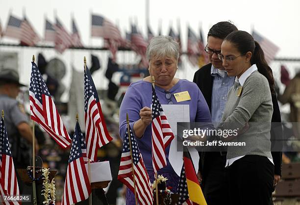 Nancy Root reads a letter placed on a memorial to Lorraine Bay before a memorial comemorating the victims of Flight 93, that crashed during the 911...