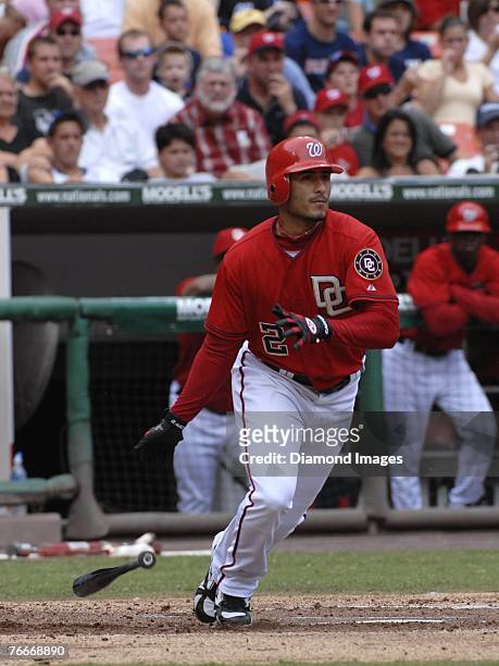 Shortstop Felipe Lopez of the Washington Nationals watches the ball he's just hit in the first inning of a game on August 19, 2007 against the New...