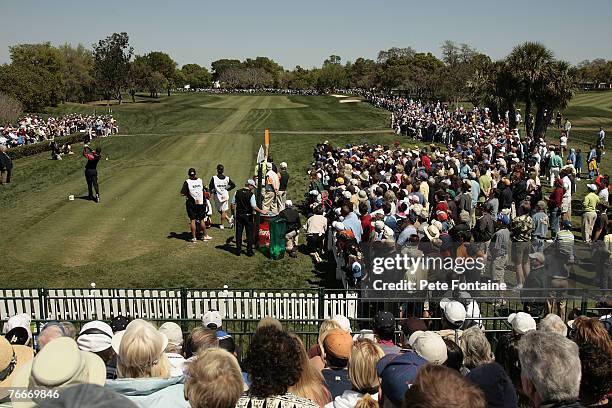 Tiger Woods watches his tee shot on the first hole during the final round of the 2007 Arnold Palmer Invitational at the Bay Hill Club and Lodge in...