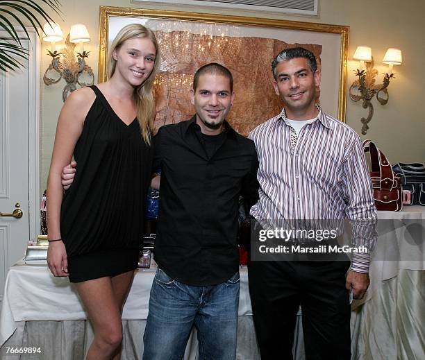 Jelly Bean, actor Guillermo Diaz, and Martin Rakovitch pose next to Chinese Laundry table at the Hearts On Fire 'Green With Envi' celebrity gift...