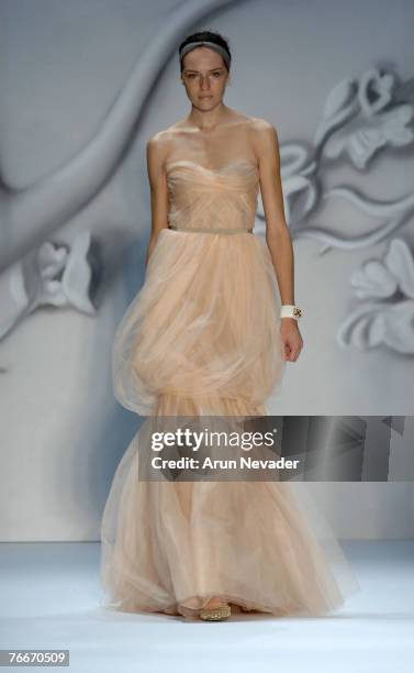 Model walks the runway wearing Monique Lhuillier Spring 2008 during Mercedes-Benz Fashion Week at the Promenade, Bryant Park on September 11, 2007 in...