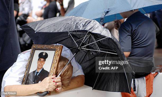 Miriam Jurabe of the Bronx, who lost her son Angel Jurabe Jr of Ladder 12 in the 11 September 2001 terrorist attacks on the World Trade Center, holds...