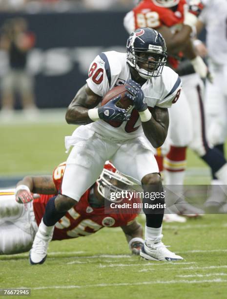 Wide receiver Andre Johnson of the Houston Texans runs with the ball during the game between the Houston Texans and the Kansas City Chiefs at Reliant...