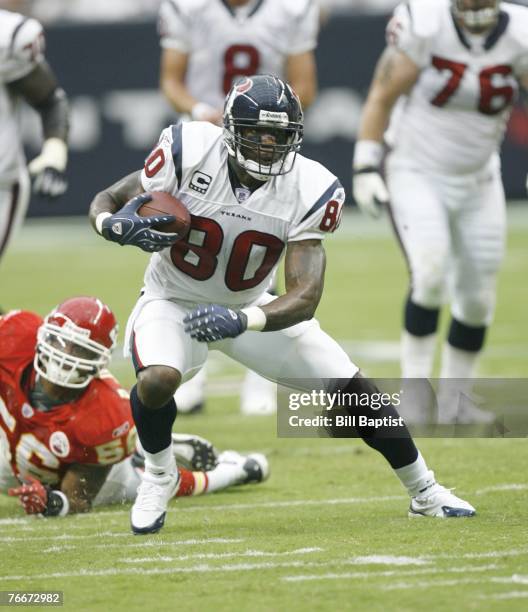 Wide receiver Andre Johnson of the Houston Texans runs with the ball during the game between the Houston Texans and the Kansas City Chiefs at Reliant...