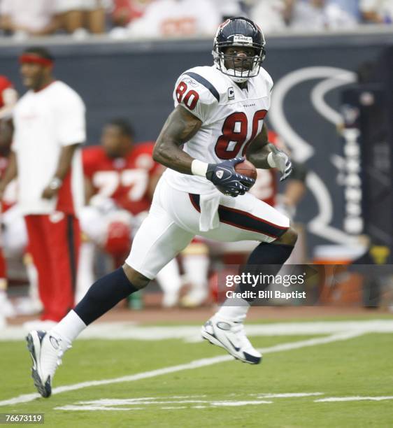 Wide receiver Andre Johnson of the Houston Texans runs with the ball during the game between the Houston Texans and the Kansas City Chiefs at Reliant...