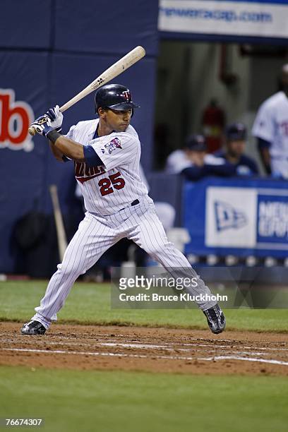 Alexi Casilla of the Minnesota Twins bats in a game against the Seattle Mariners at the Humphrey Metrodome in Minneapolis, Minnesota on August 21,...