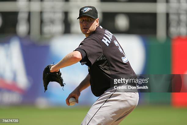 Roy Halladay of the Toronto Blue Jays pitches during the game against the Oakland Athletics at the McAfee Coliseum in Oakland, California on August...