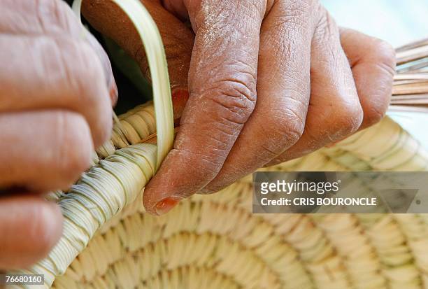 Bedouin woman makes a traditional basket at the al-Hayah community cooperative in the El-Farafra Oasis, 460 kilometers southwest of Cairo, 03...