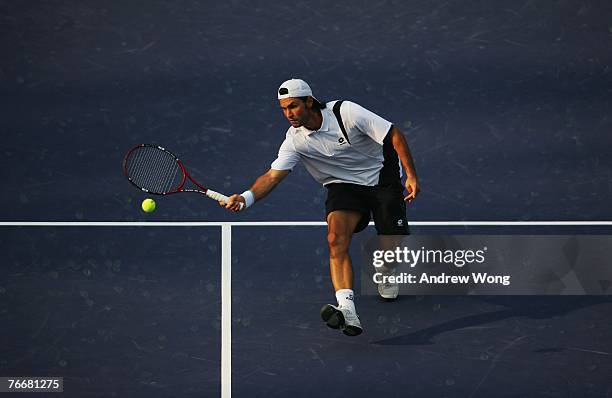 Boris Pashanski of Serbia returns a shot against Marcos Baghdatis of Cyprus during their match on day three of the China Tennis Open on September 12,...