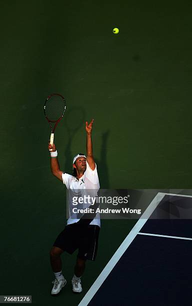 Boris Pashanski of Serbia serves against Marcos Baghdatis of Cyprus during their match on day three of the China Tennis Open on September 12, 2007 in...