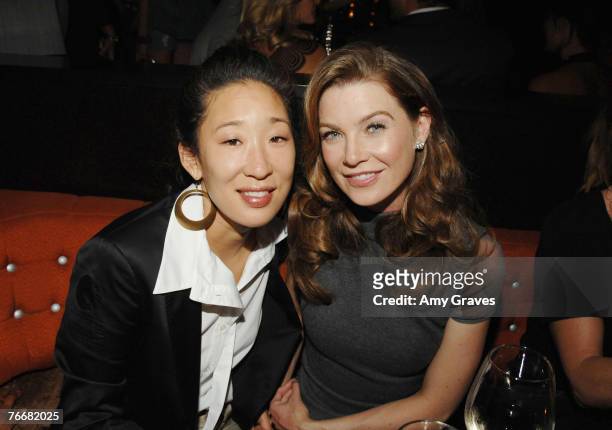 Actress Sandra Oh and actress Ellen Pompeo attend the Los Angeles Confidential Pre-Emmy Party hosted by Ellen Pompeo on September 11, 2007 in Los...