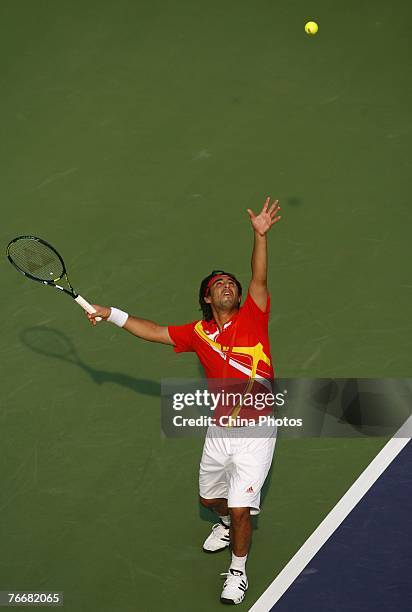 Marcos Baghdatis of Cyprus serves against Boris Pashanski of Serbia during their match on day three of the China Tennis Open on September 12, 2007 in...