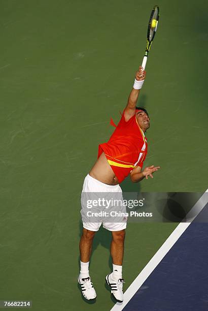 Marcos Baghdatis of Cyprus serves against Boris Pashanski of Serbia during their match on day three of the China Tennis Open on September 12, 2007 in...