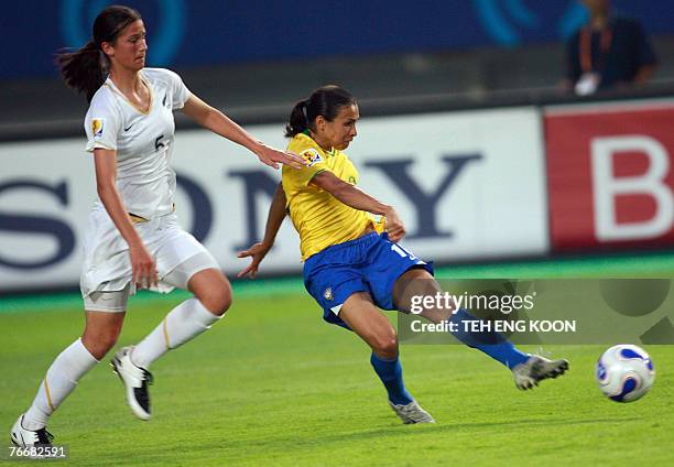 Brazil's Marta Vieira Da Silva scores her first goal as New Zealand's Abby Erceg looks on during their Group D Women's World Cup football match in...