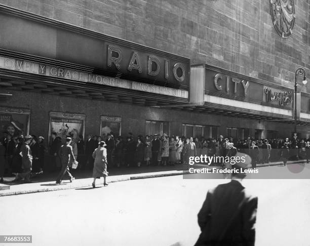 Queue for Josef von Sternberg's musical, 'The King Steps Out' outside Radio City Music Hall in the Rockefeller Center, New York, 1936.