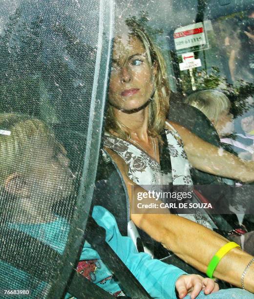 Kate McCann drives out of her home in Rothley, Leicestershire, in central England, 12 September 2007, with her children Sean and Amelie. As the...