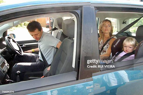 Kate and Gerry McCann drive out of their home in Rothley, Leicestershire, in central England, 12 September 2007, with children Sean and Amelie. As...