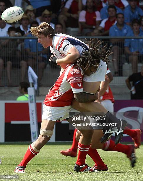 Tonga's lock Paino Hehea blocks USA's prop Louis Stanfill during the rugby union World Cup group A match between USA and Tonga, 12 September 2007 at...