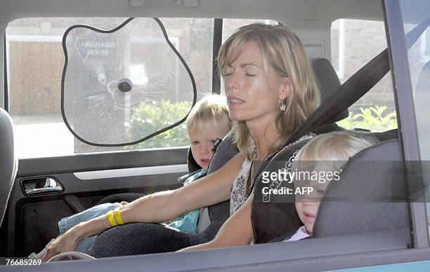 Kate McCann leaves her home in Rothley, Leicestershire, central England, with her daughter Amelie and son Sean, 12 September 2007. As the pressure...