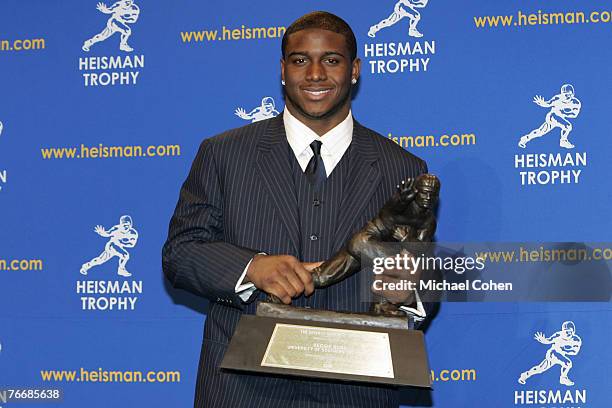 Reggie Bush, University of Southern California tailback holds the Heisman Trophy during the 2005 Heisman Trophy presentation at the Hard Rock Cafe in...