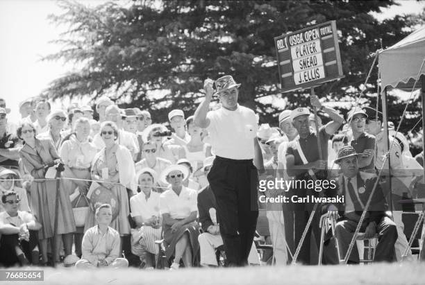 American golfer Sam Snead raises his right hand after his shot during the at United States Open Championship at Cherry Hills Country Club, Cherry...