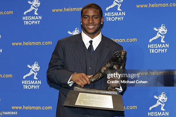 Reggie Bush, University of Southern California tailback holds the Heisman Trophy during the 2005 Heisman Trophy presentation at the Hard Rock Cafe in...